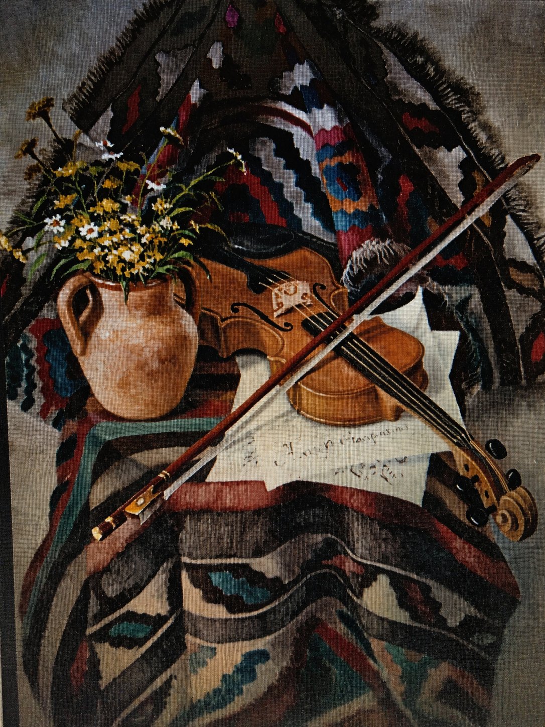 Rustic still life with violin, flowers and folk textiles