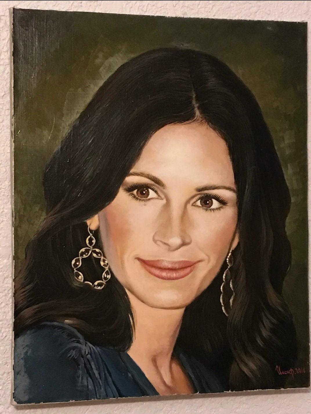 Oil portrait of a woman with dark hair and earrings